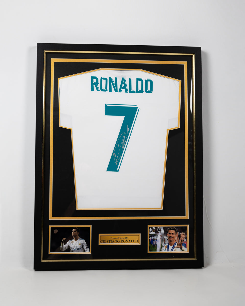 Framed signed Cristiano Ronaldo Real Madrid 2017/18 final season collector's replica jersey in a black and gold display frame
